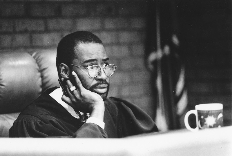 Judge Leo Bowman seated in a courtroom