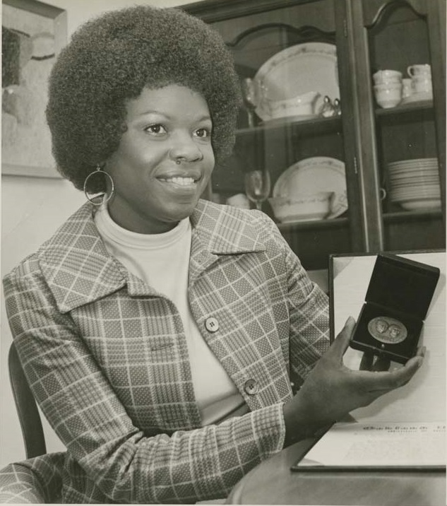 Augustine Wright showing her Wilson award