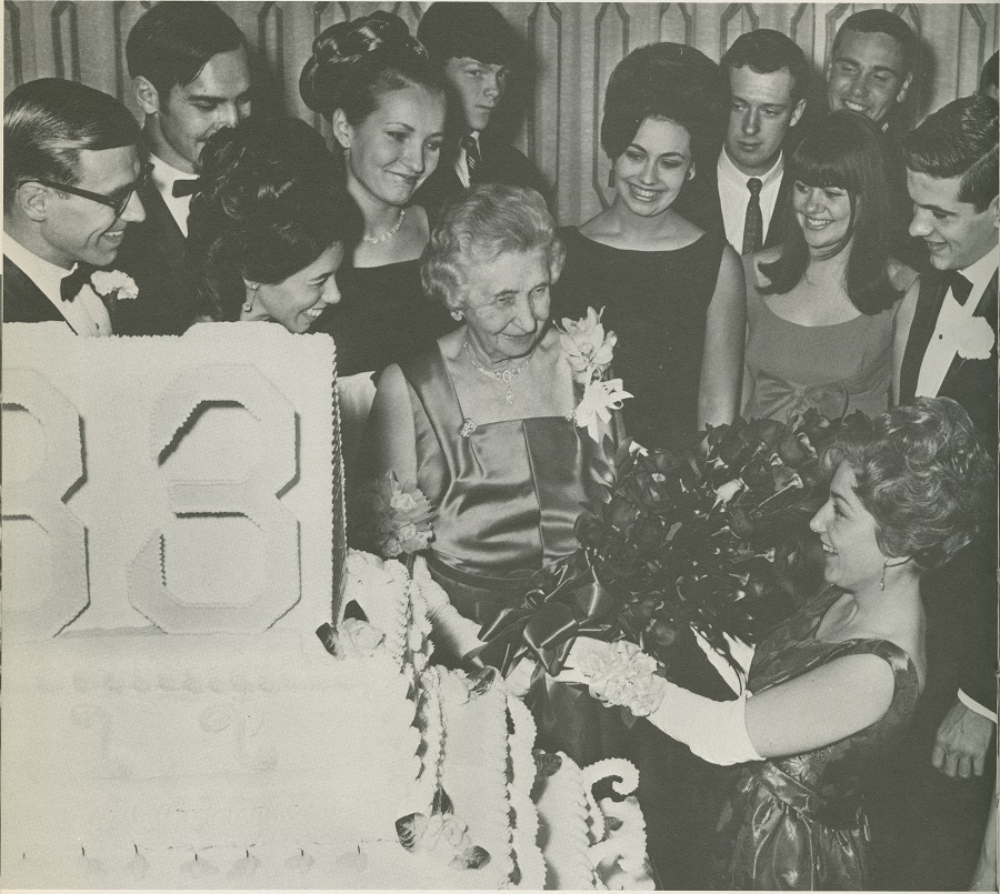 Mrs. Wilson with roses and her birthday cake