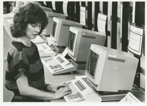 Librarian using computer terminal