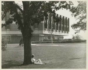 Student seated outside Kresge Library